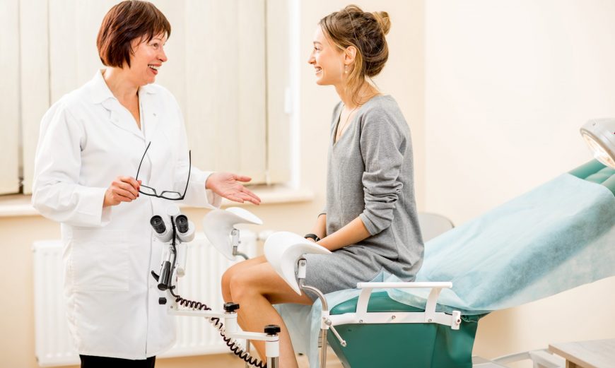 Young woman patient with gynecologist in the office